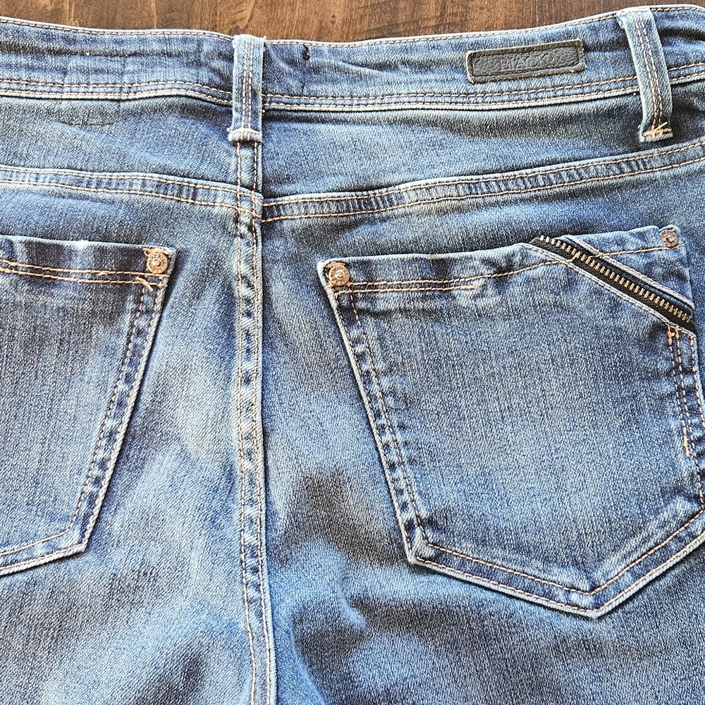 Light Blue Skinny Jeans with Vintage Fading and Textured Fabric